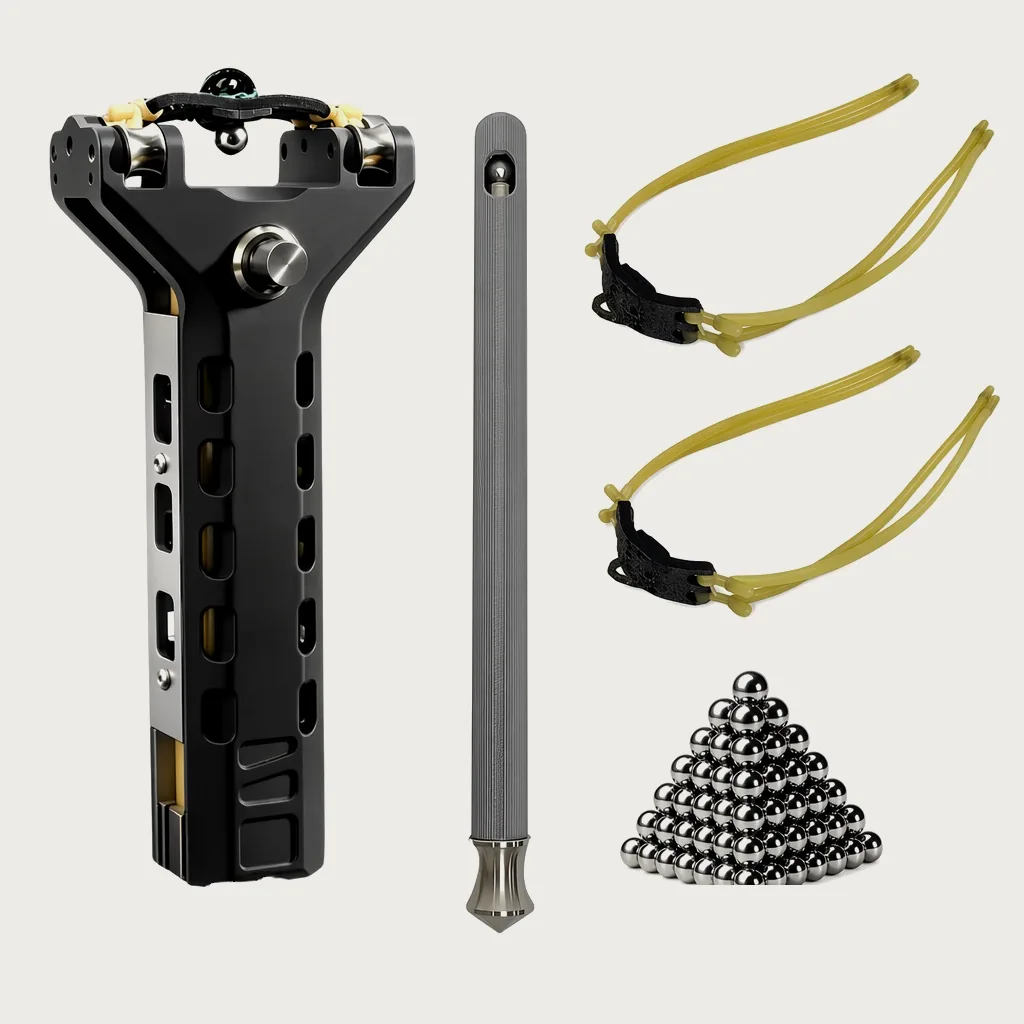 Lieferumfang: Schleuder, Kugelmagazin als Aluminiumstab, zwei gelbe Bandsätze mit Lederschlaufe und eine Pyramide aus 100 Stahlkugeln